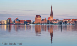 Rostock, Germany. City skyline reflecting in water of Warnow river